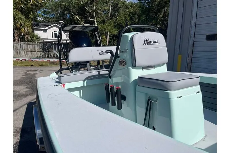 Slide: The Image of 2026 Maverick 18 HPX-V boat on trailer, parked outside a garage. - 4