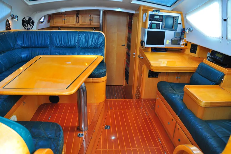 Slide: The Image of Luxurious interior of 2000 Custom Steel Cutter World Cruiser yacht with wood and leather furnishings. - 10