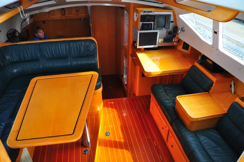 Slide: The Image of Luxurious interior of 2000 Custom Steel Cutter World Cruiser yacht with leather seating and navigation equipment. - 17