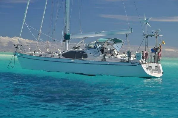 Slide: The Image of Sailing yacht "World Cruiser" by Custom Steel Cutter, 2000, on clear turquoise waters. - 2