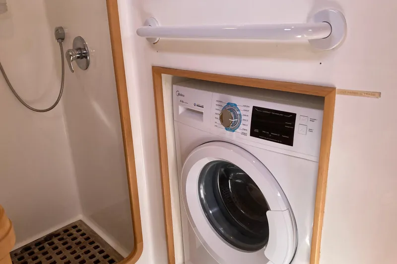 Slide: The Image of Compact washing machine in a Custom Steel Cutter World Cruiser yacht bathroom, 2000 model. - 23