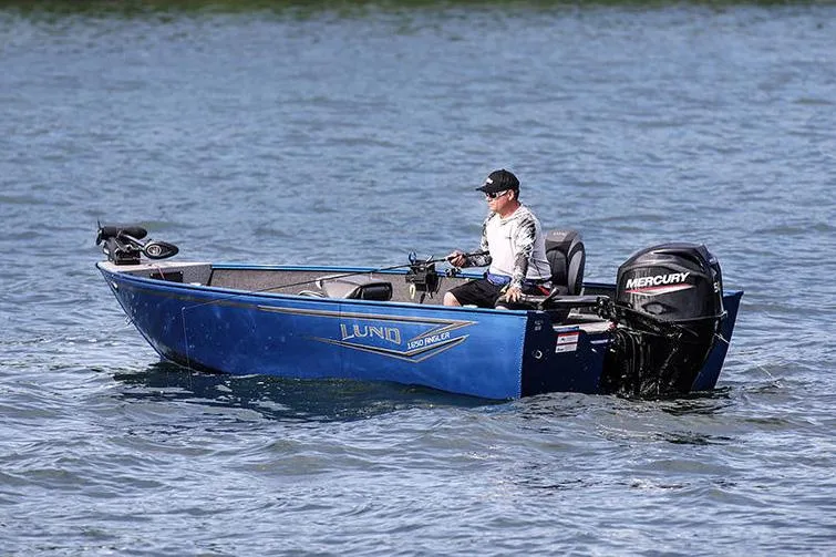 Slide: The Image of Manufacturer Provided Image: 2025 Lund 1650 Angler Tiller boat on water with Mercury outboard motor. - 2