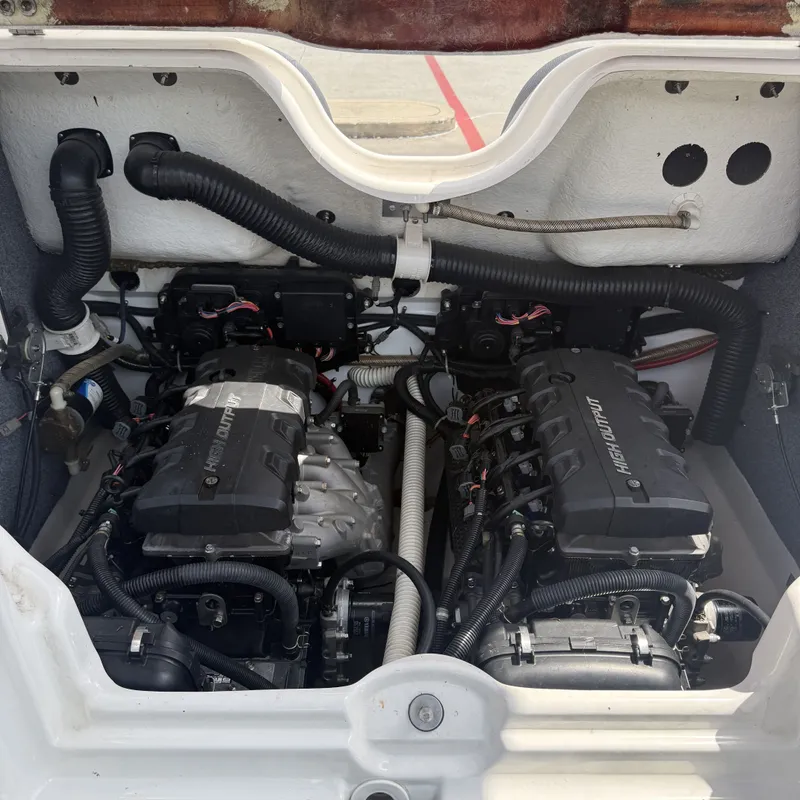 Slide: The Image of The engine compartment of a 2014 Yamaha Boats 212X features two powerful engines. - 31