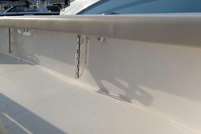 Slide: The Image of 2026 Key West 250 Bay Reef boat interior detail with rod holders. - 11