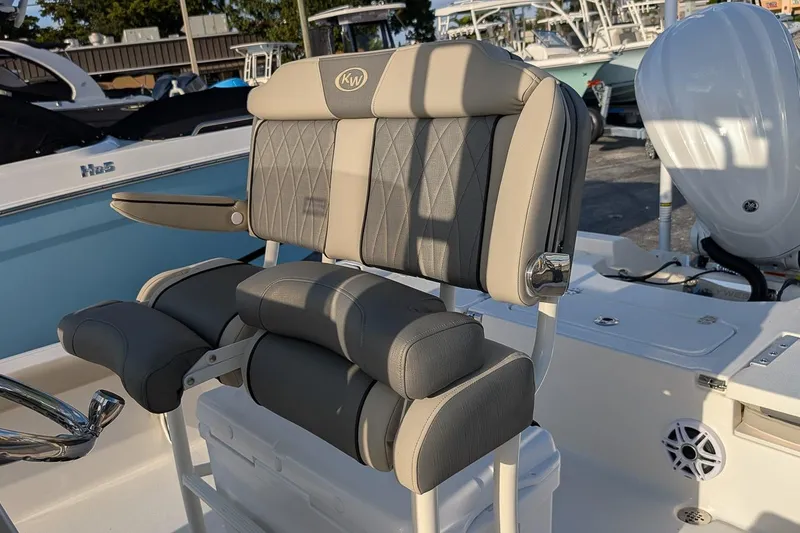 Slide: The Image of 2026 Key West 250 Bay Reef boat seat with armrests and cushioned backrest. - 12