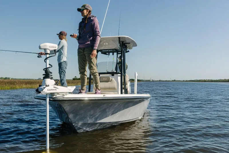 Slide: The Image of Manufacturer Provided Image: 2025 Key West 250 Bay Reef boat with anglers fishing on calm waters. - 22