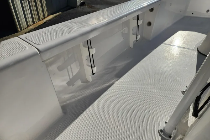 Slide: The Image of Interior view of 2026 BlackJack 224 boat, showcasing sleek white deck design. - 12