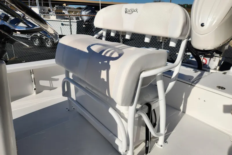 Slide: The Image of 2026 BlackJack 224 boat seat with white upholstery and sturdy metal frame. - 16