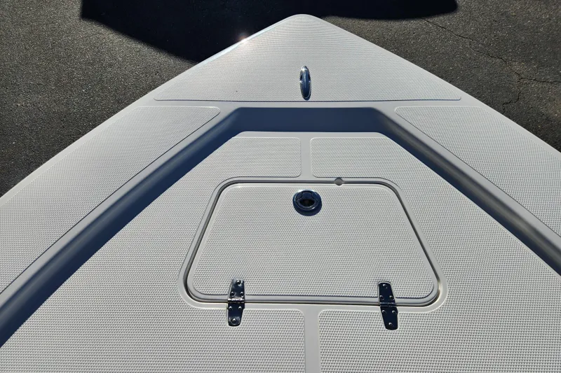 Slide: The Image of Bow of 2026 BlackJack 224 boat with storage hatch and textured surface. - 8