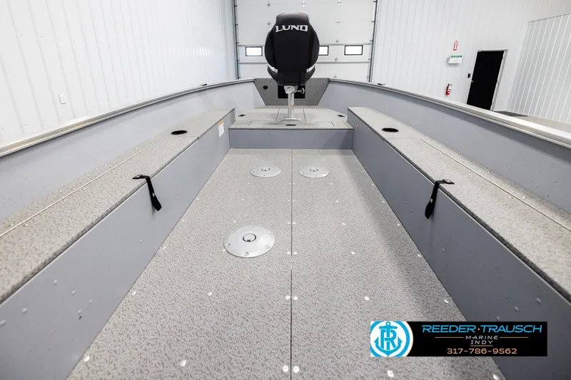 Slide: The Image of 2026 Lund 1600 Fury Tiller boat interior, spacious layout, gray finish, Reeder Trausch Marine logo. - 12
