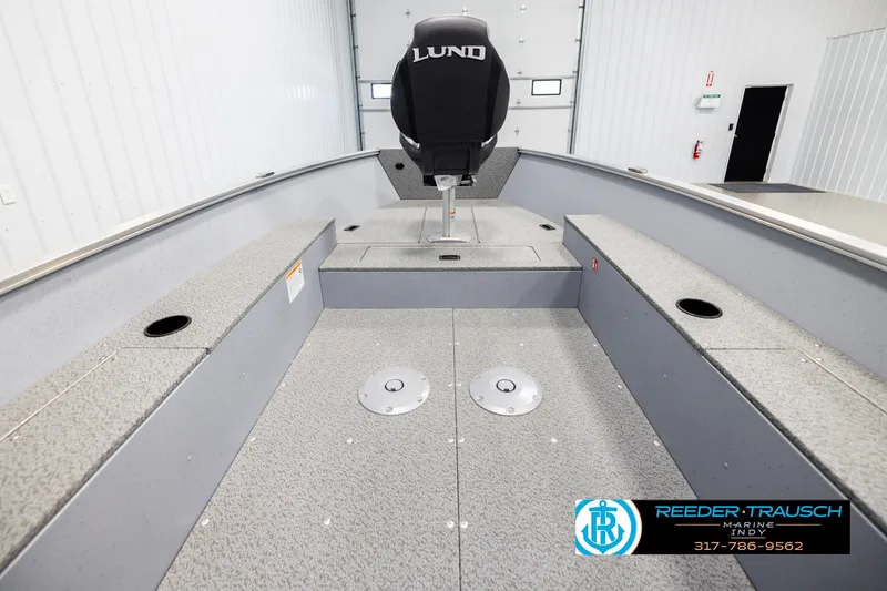 Slide: The Image of 2026 Lund 1600 Fury Tiller boat interior with seating and storage compartments. - 13