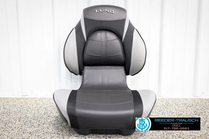 Slide: The Image of 2026 Lund 1600 Fury Tiller boat seat, black and gray design, displayed indoors. - 29