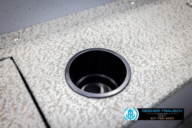 Slide: The Image of 2026 Lund 1600 Fury Tiller boat cup holder on textured surface. - 30