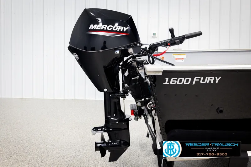 Slide: The Image of 2026 Lund 1600 Fury Tiller boat with Mercury outboard motor in showroom. - 32