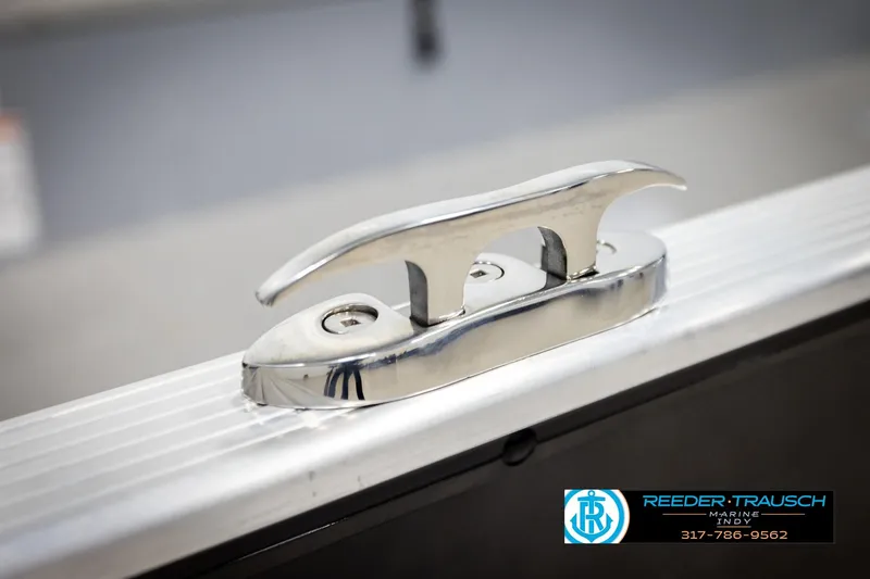 Slide: The Image of 2026 Lund 1600 Fury Tiller boat cleat detail with Reeder-Trausch Marine logo. - 41