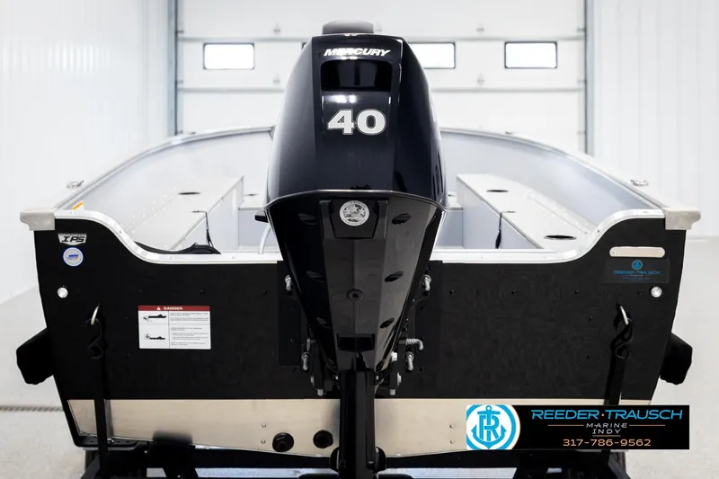 Slide: The Image of 2026 Lund 1600 Fury Tiller boat with Mercury 40 engine in showroom. - 6