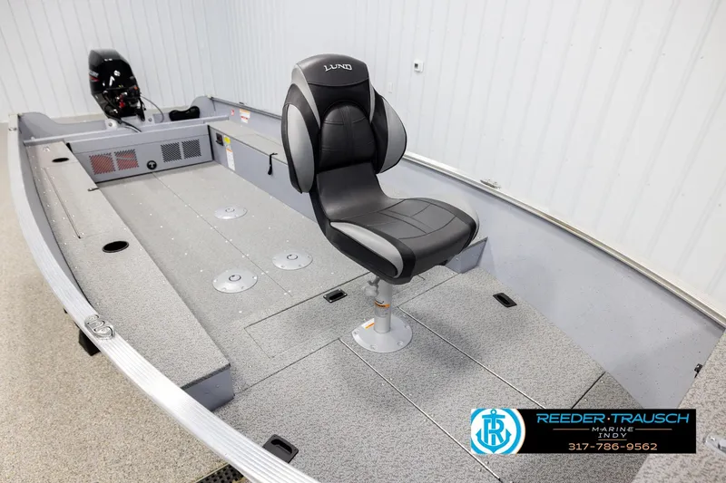 Slide: The Image of 2026 Lund 1600 Fury Tiller boat interior with swivel seat and motor. - 8