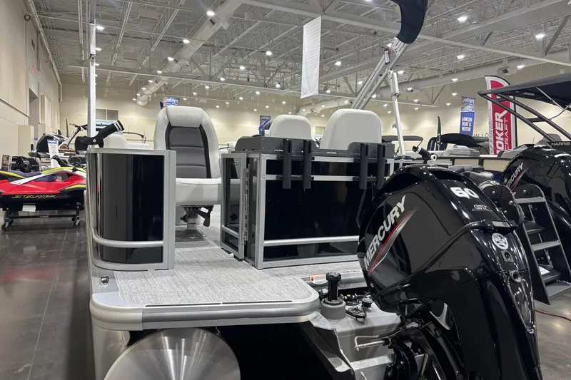 Slide: The Image of 2026 Harris Cruiser 210 pontoon boat with Mercury engine displayed indoors. - 15