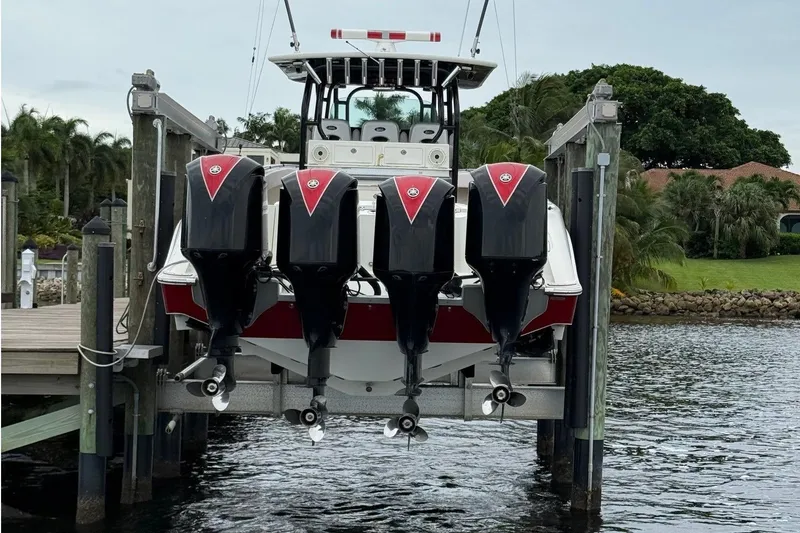 Slide: The Image of 2013 Hydra-Sports 42 boat with four powerful outboard engines on a lift. - 4