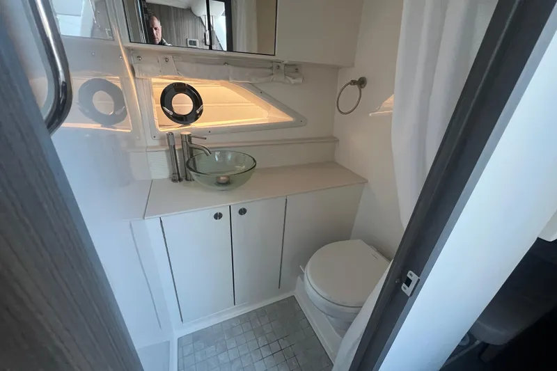Slide: The Image of Luxurious bathroom in 2025 Sea Ray Sundancer 320 Coupe yacht, featuring modern fixtures and elegant design. - 12