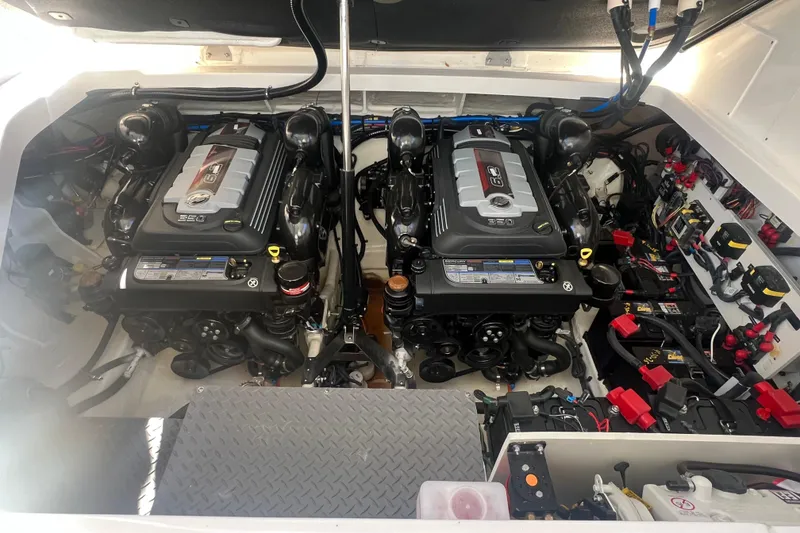 Slide: The Image of Engine room of 2025 Sea Ray Sundancer 320 Coupe with dual engines and electrical components. - 13