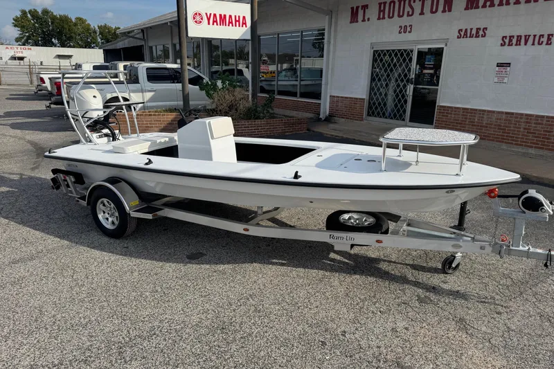 The Image of 2026 Chittum Skiffs 18 Laguna Madre boat on trailer outside dealership. - 0