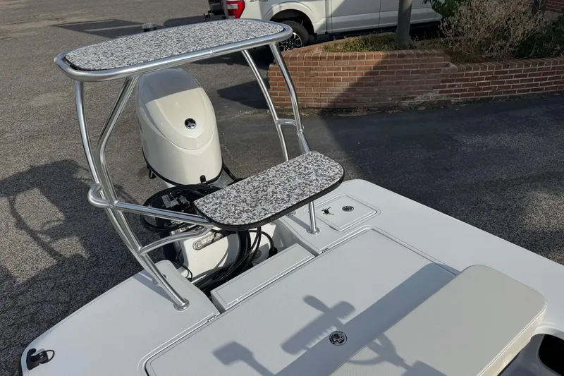 Slide: The Image of 2026 Chittum Skiffs 18 Laguna Madre boat with elevated platform and outboard motor. - 15