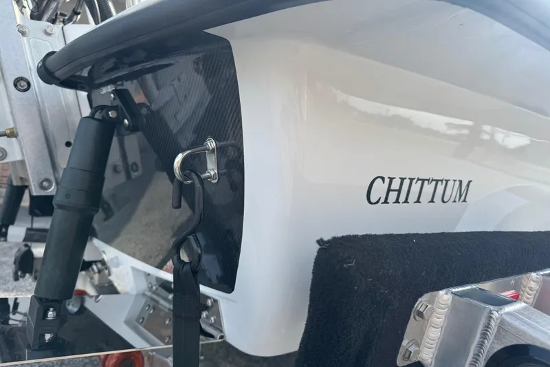 Slide: The Image of 2026 Chittum Skiffs 18 Laguna Madre boat detail with logo and hardware. - 18