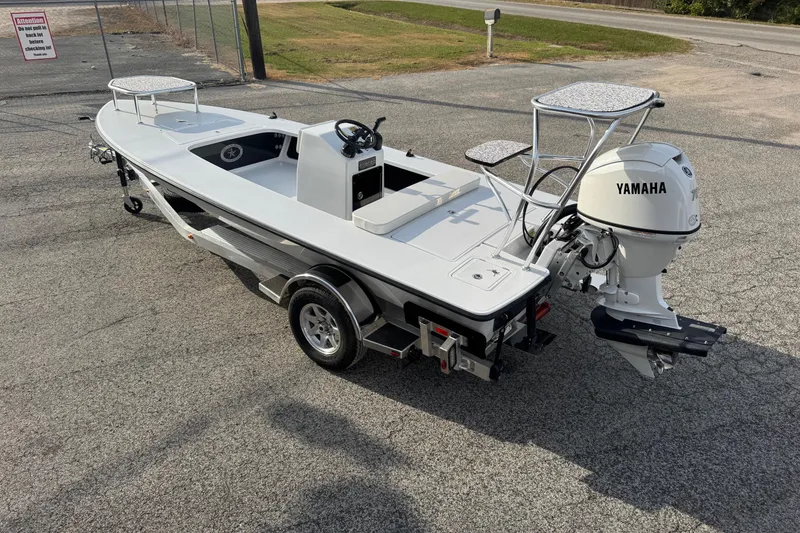 Slide: The Image of 2026 Chittum Skiffs 18 Laguna Madre boat with Yamaha motor on trailer. - 2
