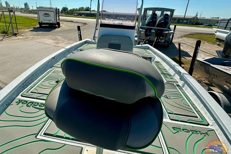 Slide: The Image of 2024 Xpress H20B Bay boat with stylish seating and modern design features. - 11