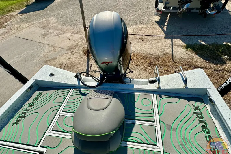 Slide: The Image of 2024 Xpress H20B Bay boat with motor, featuring stylish deck design. - 21
