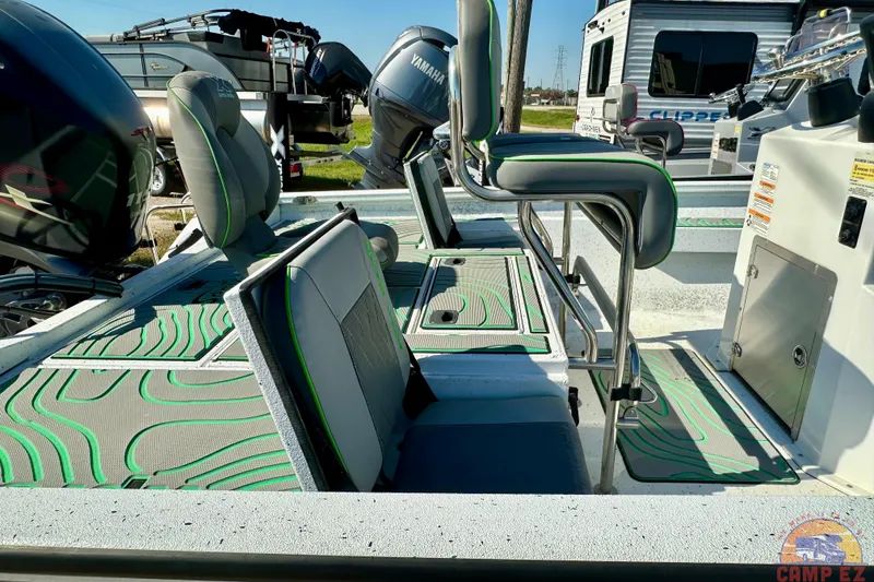 Slide: The Image of 2024 Xpress H20B Bay boat interior with seating and Yamaha engine. - 24