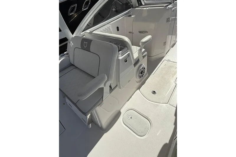 Slide: The Image of 2025 Sea Fox 288 Traveler boat interior with seating and control panel. - 10