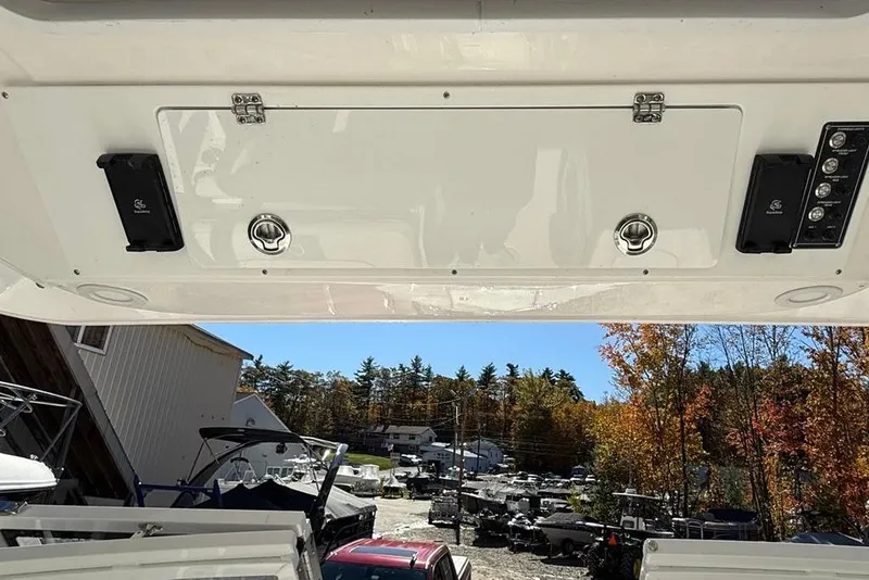 Slide: The Image of 2025 Sea Fox 288 Traveler boat interior with storage compartment and speakers. - 12