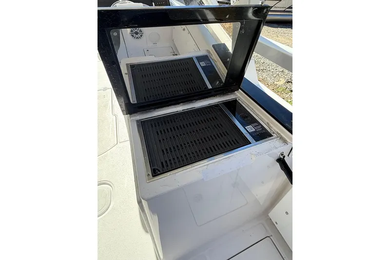 Slide: The Image of Interior view of 2025 Sea Fox 288 Traveler boat with grill and storage area. - 13