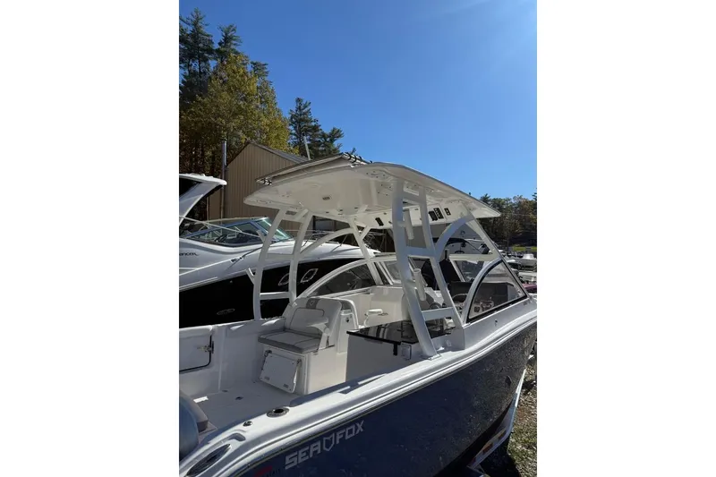 Slide: The Image of 2025 Sea Fox 288 Traveler boat with sleek design under clear blue sky. - 3