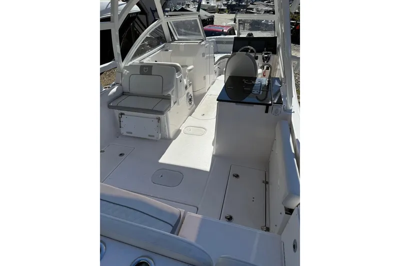 Slide: The Image of 2025 Sea Fox 288 Traveler boat interior with seating and helm station. - 5