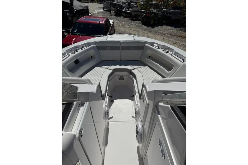 Slide: The Image of 2025 Sea Fox 288 Traveler boat interior with cushioned seating and storage compartments. - 8