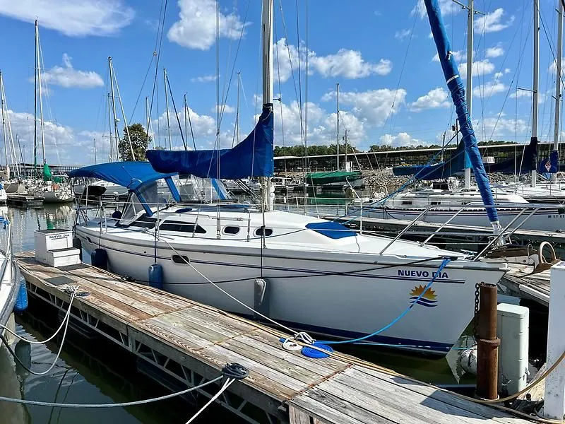 Slide: The Image of Catalina 320 sailboat docked at marina, clear sky, 2000 model. - 10