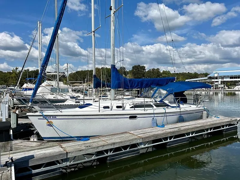 Slide: The Image of Catalina 320 sailboat docked at marina under blue sky, 2000 model. - 2