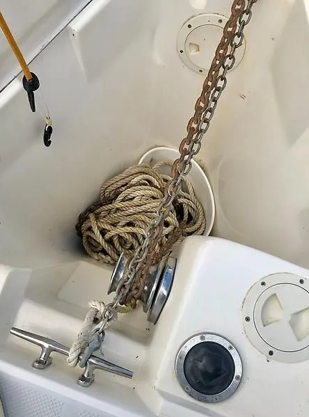 Slide: The Image of Anchor chain and rope on a 2000 Catalina 320 sailboat deck. - 24