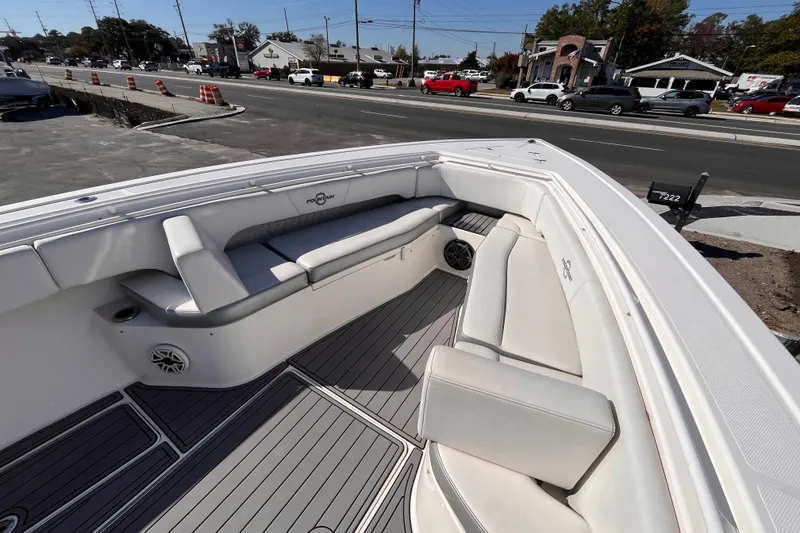 Slide: The Image of 2019 Fountain 38 Center Console boat interior with white seating and gray flooring. - 13