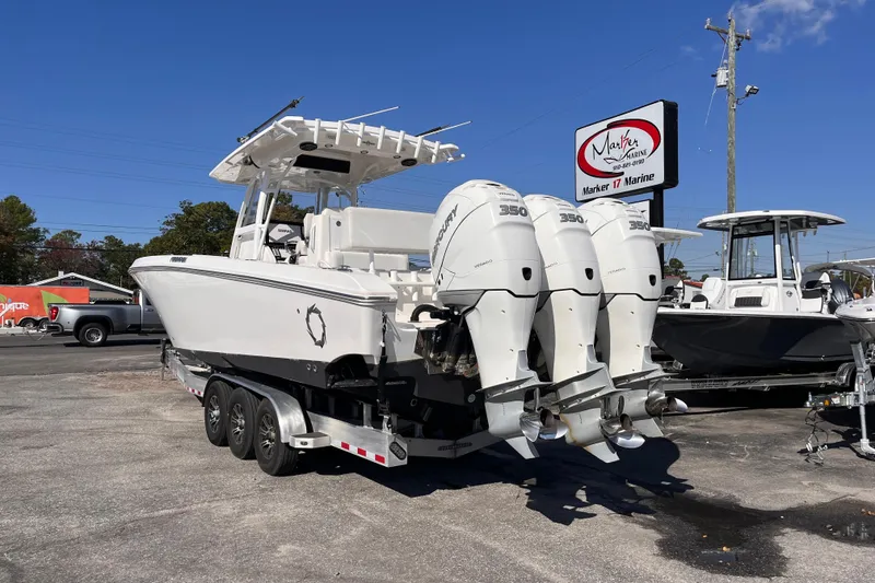 Slide: The Image of 2019 Fountain 38 Center Console boat with triple Mercury 350 engines at Marker 17 Marine. - 2