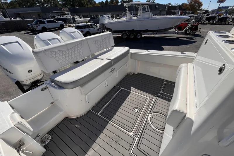 Slide: The Image of 2019 Fountain 38 Center Console boat interior with seating and outboard engines. - 6