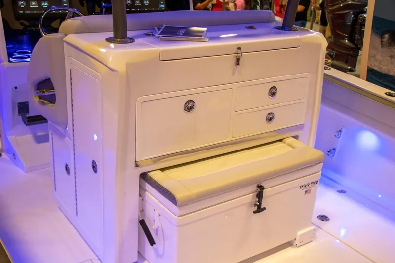 Slide: The Image of Manufacturer Provided Image: 2025 Nor-Tech 340 Sport Center Console interior with storage compartments and seating. - 11