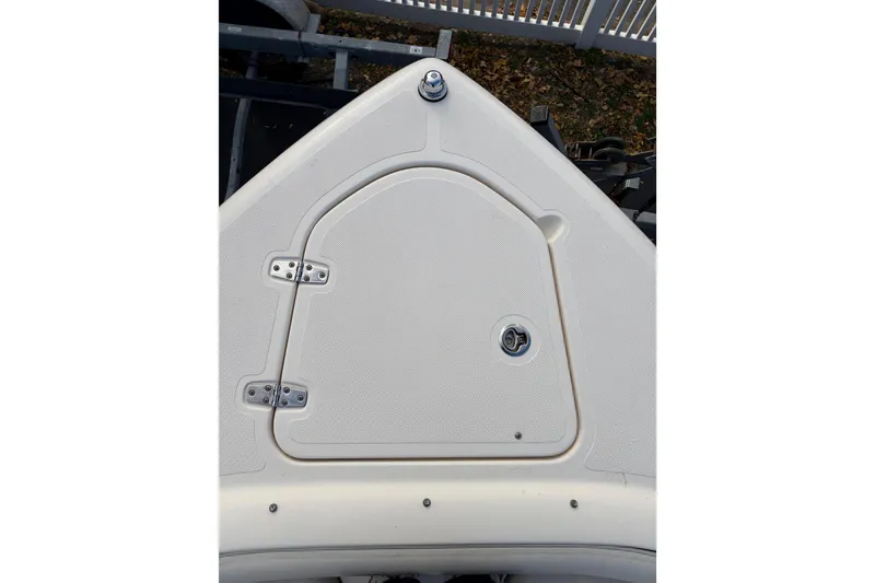 Slide: The Image of 2012 Pursuit DC 265 Dual Console boat deck with storage hatch. - 9