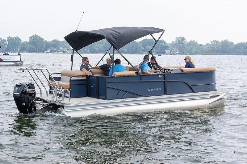 Slide: The Image of Manufacturer Provided Image: 2025 Crest Conquest SE 200 Cruise pontoon boat on a lake with passengers. - 11