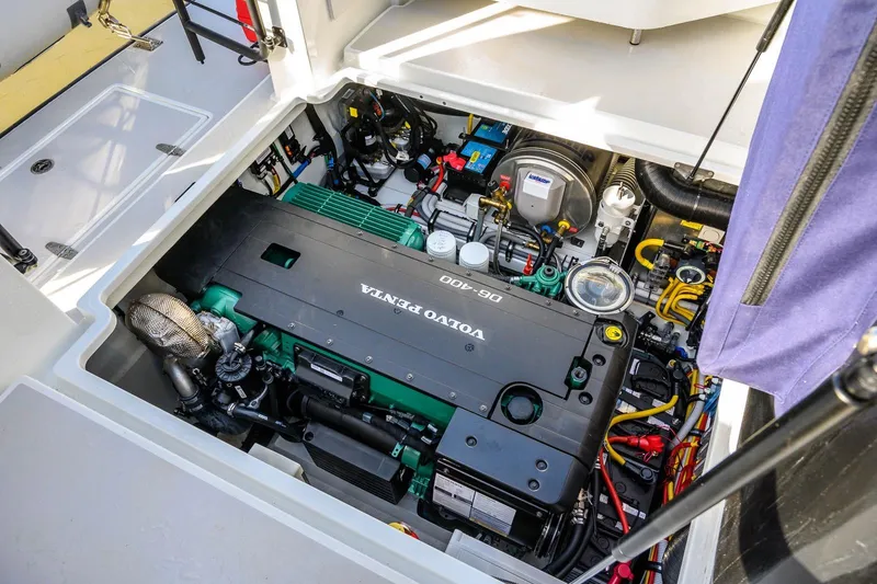 Slide: The Image of Engine compartment of 2023 Targa 27.2 boat featuring Volvo Penta D6-400 engine. - 11