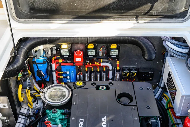 Slide: The Image of Engine compartment of 2023 Targa 27.2 boat, showcasing wiring and components. - 14