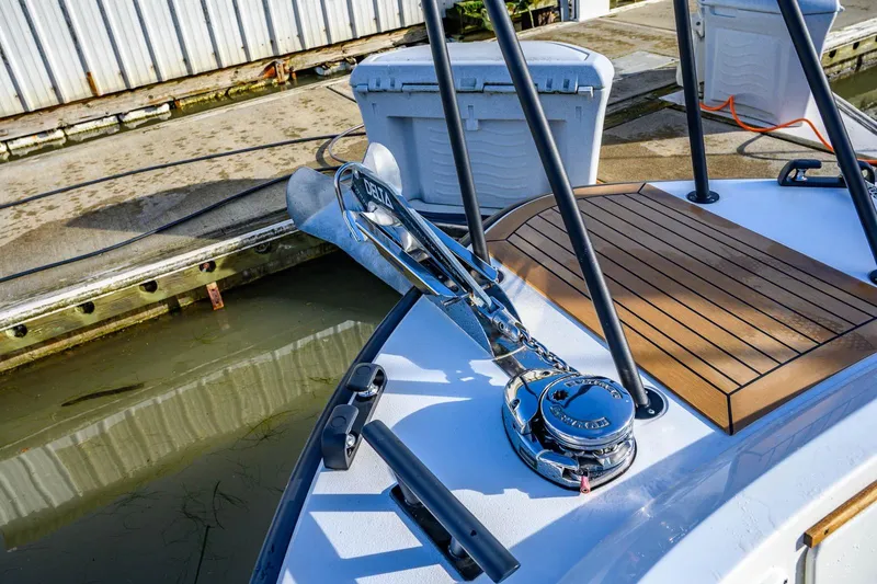 Slide: The Image of 2023 Targa 27.2 boat deck with anchor and wooden platform at dock. - 18